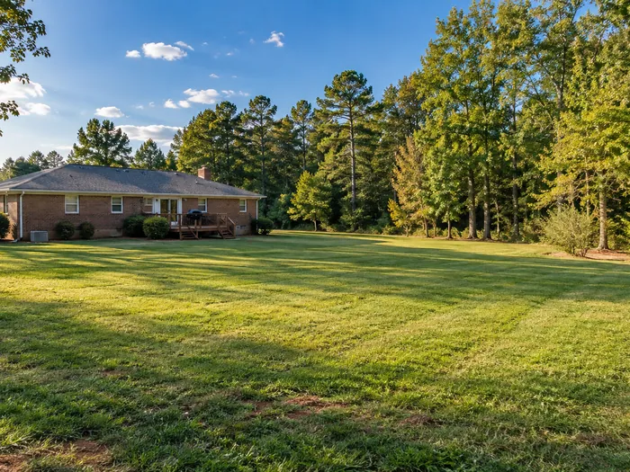 A rural North Carolina property with a long lawn where the septic drain field runs